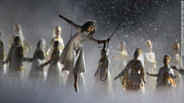 A girl takes a magical kite ride through history during the opening ceremony.