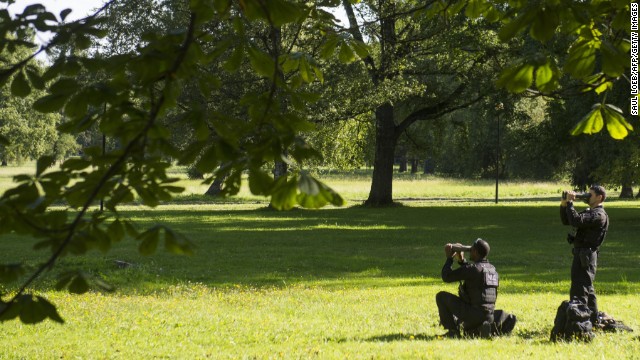 Members of the Secret Service keep watch as Obama meets with the Estonian President in Tallinn on September 3.