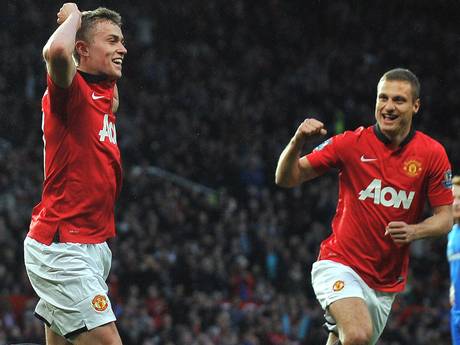 James Wilson celebrates with Nemanja Vidic, who was making his last appearance at Old Trafford for United (Getty)