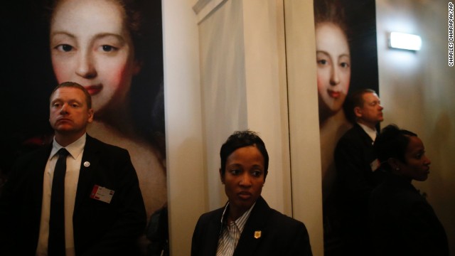 Estonian security, left, and a U.S. Secret Service agent stand after Obama and the leaders of Estonia, Latvia and Lithuania made statements September 3 at Kadriorg Art Museum in Tallinn.