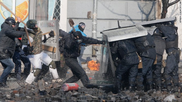 Anti-government protesters clash with riot police outside Ukraine's parliament in Kiev on February 18.