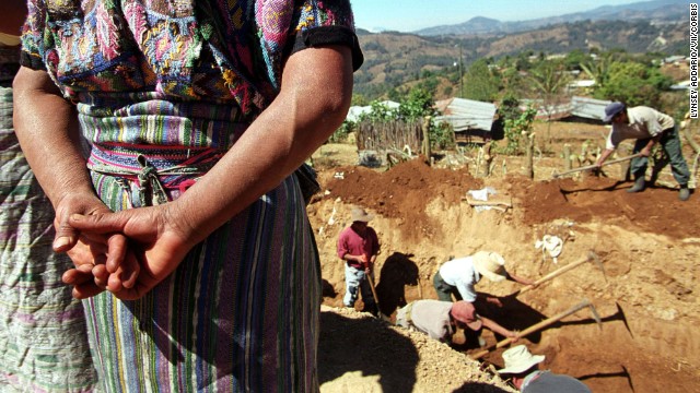 Archeologists in March 2002 exhume remains of victims from a massacre alleged to have taken place in 1982 during Guatemala's civil war in the town of Xiquin Senai. 