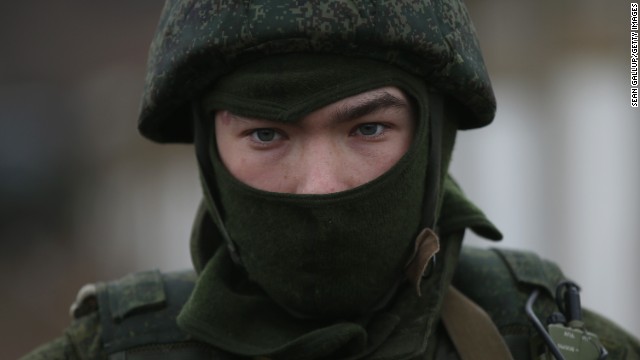 A soldier who was among several hundred that took up positions near a Ukrainian military base stands near the base's periphery in Crimea on March 2.