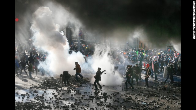 Protesters fight with riot police during a new wave of violent clashes February 18 in Kiev.