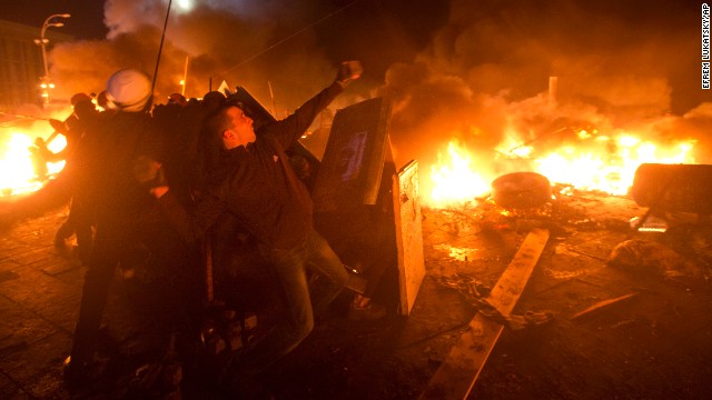 Protesters clash with riot police in Kiev's Independence Square on Tuesday, February 18.