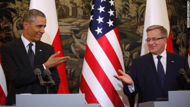 U.S. President Barack Obama, left, and Polish President Bronislaw Komorowski gesture toward each other at a news conference in Warsaw, Poland, on Tuesday, June 3. Poland is the first stop on Obama's three-country European trip that is intended, in part, to reassure allies unnerved by Russia's annexation of Ukraine's Crimea region.