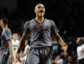 Massachusetts' Derrick Gordon reacts after hitting the go-ahead basket with one second left on the clock during overtime of an NCAA college basketball game against Providence, Saturday, Dec. 28, 2013, in Amherst, Mass. UMass won 69-67. (AP Photo/Jessica Hill)
