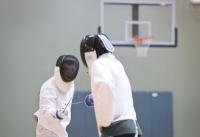 Twin Peaks Charter Academy sophomore Johntue Holt and freshman Alex Chervets, right, practice at fencing club.