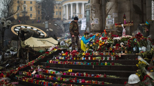 A protester stands at a memorial on March 1 for the people killed in clashes with the police at Kiev's Independence Square.