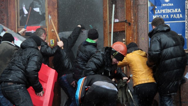 Pro-Russian activists clash with Maidan supporters as they storm the regional government building in Kharkiv on March 1.