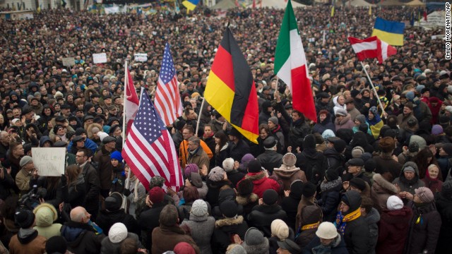 Protesters hold flags of the United States, Germany and Italy during a rally in Kiev's Independence Square on March 2.