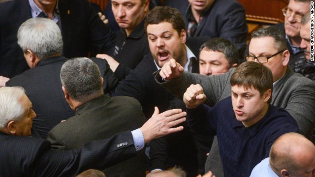 Ukrainian lawmakers argue during a session of Parliament on Friday, February 21.