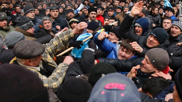 Pro-Russian demonstrators, right, clash with anti-Russian protesters in front of a government building in Simferopol on February 26. 
