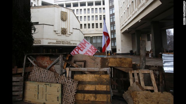 Barricades in front of a government building in Simferopol on February 27 hold a banner that reads: Crimea Russia. There's a broad divide between those who support the pro-Western developments in Kiev and those who back Russia's continued influence in Crimea and across Ukraine.