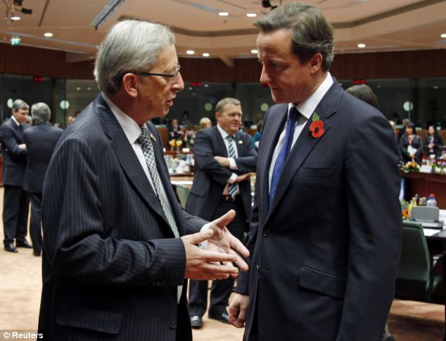 Dr Fox describes the Prime Minister's (right) willingness to veto the appointment as European commission leader of Jean-Claude Juncker (left), 'the epitome of the despised Eurocracy', as a 'breath of fresh air'