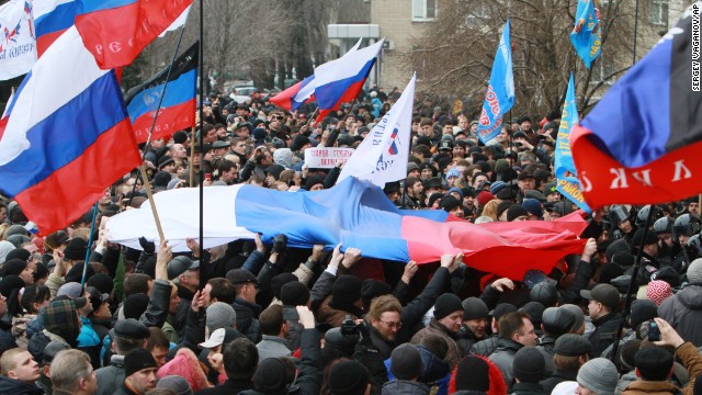 Pro-Russian activists hold Russian flags during a rally in the center of Donetsk, Ukraine, on March 1.