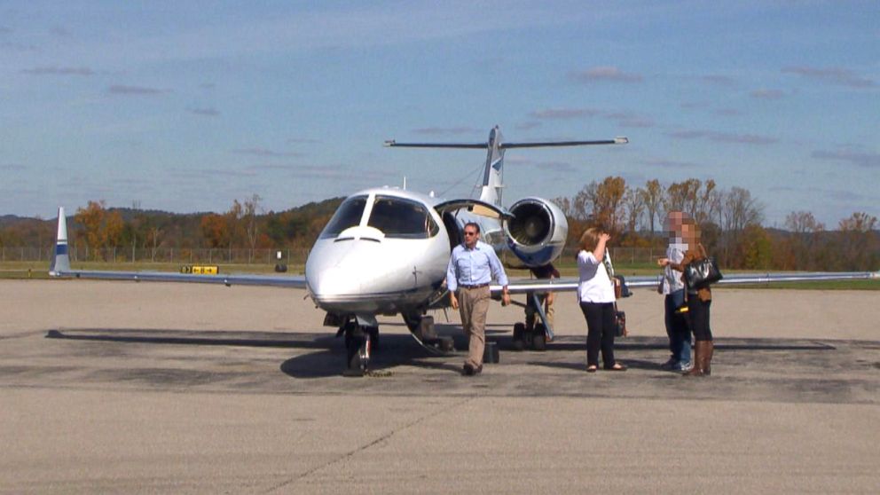 PHOTO: Attorney Michael Fuller, left, and colleagues arrive in West Virginia on Fullers private plane.
