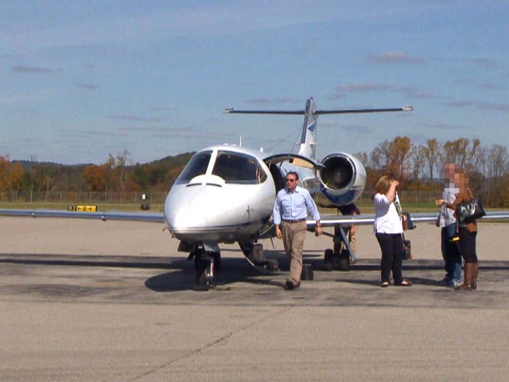 PHOTO: Attorney Michael Fuller, left, and colleagues arrive in West Virginia on Fullers private plane.