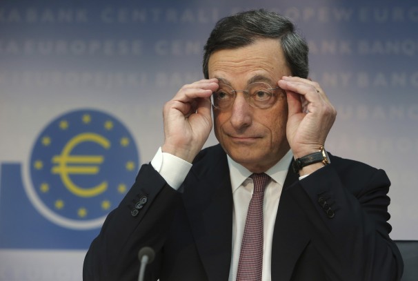 Mario Draghi, president of the European Central Bank (ECB), adjusts his spectacles during a news conference in Frankfurt, Germany, on Thursday, July 5, 2012. The European Central Bank cut interest rates to a record low and said it won't pay anything on overnight deposits as the sovereign debt crisis threatens to drive the euro region into recession. Photographer: Hannelore Foerster/Bloomberg *** Local Caption *** Mario Draghi