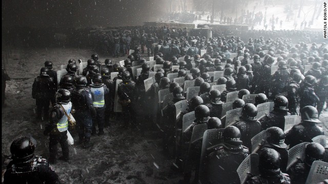 Riot police officers gather as they clash with protesters in the center of Kiev on January 22.