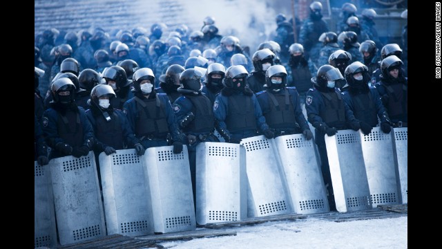 Riot police stand guard near Dynamo Stadium on January 24.