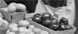 Young boy tending freshly stocked fruit and vegetable stand at Center Market, 02/18/1915 (detail)