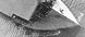 <em>Langley</em> (CV1), formerly the <em>Jupiter</em>. Aerial, bow on, plane on deck, 08/03/1923 (detail)” /></a> <br clear=