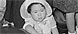 "Granada Relocation Center, Amache, Colorado. Shown here is a young miss, dressed in her Sunday best ..., 10/06/1945," (detail)